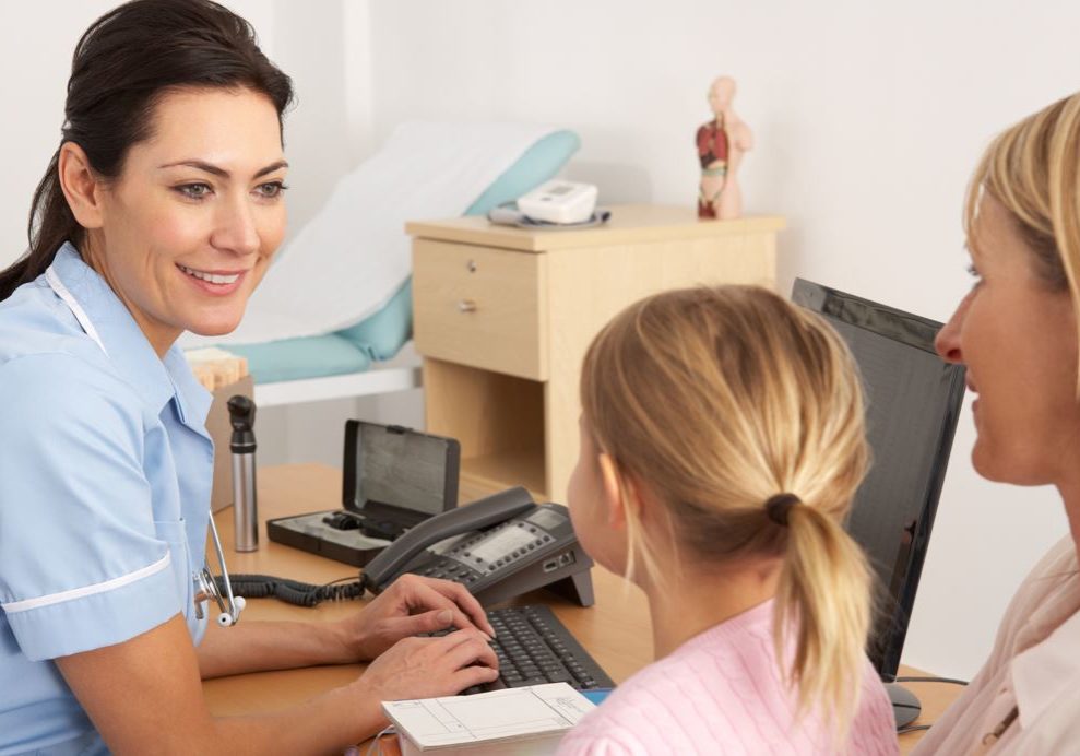 NHS nurse with patient and child